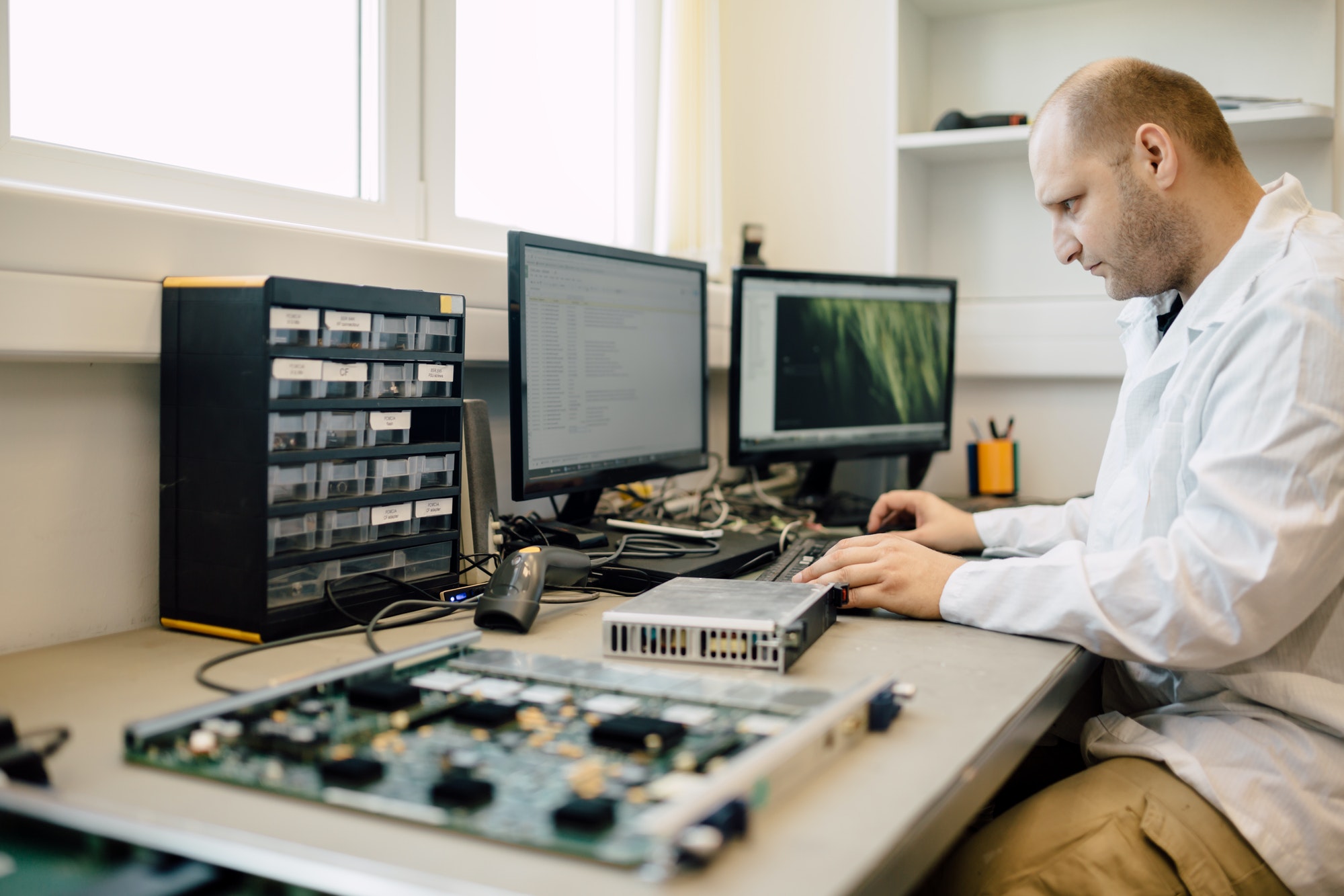 Technician repairing cmts cards at Absolute ICT